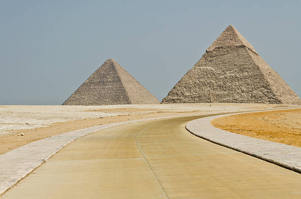 The concrete road turns to the Egyptian pyramids in the middle of...