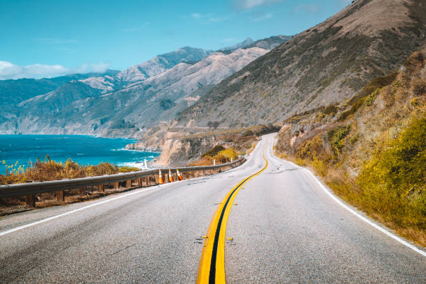 Famous Highway 1 at Big Sur, California Central Coast, USA Scenic view of world famous Highway 1 with the rugged coastline of Big Sur in beautiful golden evening light at sunset in summer, California Central Coast, USA road trip stock pictures, royalty-free photos & images