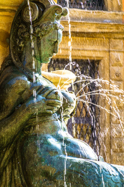 famous neptune well at the old town of Bologna in italy famous neptune well at the old town of Bologna in italy - photo poseidon statue stock pictures, royalty-free photos & images