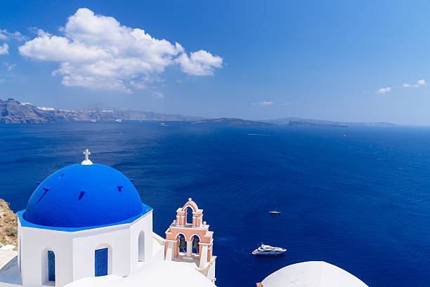 Famous Santorini blue dome churches stock photo