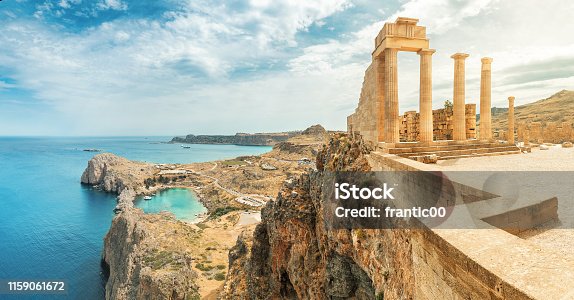 istock Famous tourist attraction - Acropolis of Lindos. Ancient architecture of Greece. Travel destinations of Rhodes island 1159061672