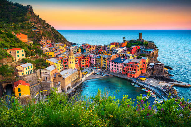 Famous touristic town of Liguria with beaches and colorful houses Majestic touristic village on the hill with colorful mediterranean buildings. Fantastic travel and photography place at sunset, Vernazza, Cinque Terre National Park, Liguria, Italy, Europe bay of water photos stock pictures, royalty-free photos & images