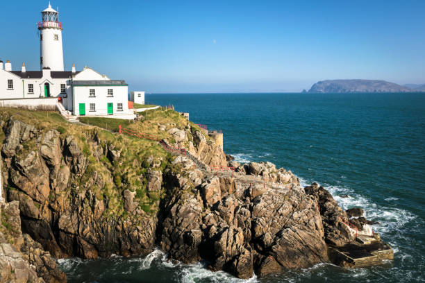 Fanad Lighthouse on a Rocky Coast This is a picture of Fanad Light house on the northern coast of Donegal, Ireland inishowen peninsula stock pictures, royalty-free photos & images