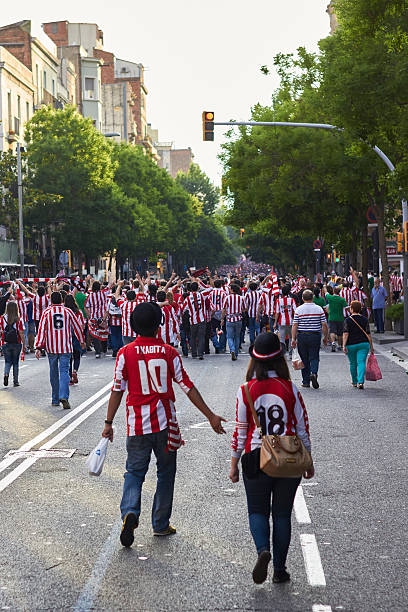 Fans on final match of cup of spain 2015 Barcelona, Spain - May 30, 2015: BARCELONA, SPAIN - may 30 2015: Final match of cup of spain 2015, Fans walking to Camp Nou stadium for FC Barcelona and Athletic Bilbao match fc barcelona stock pictures, royalty-free photos & images