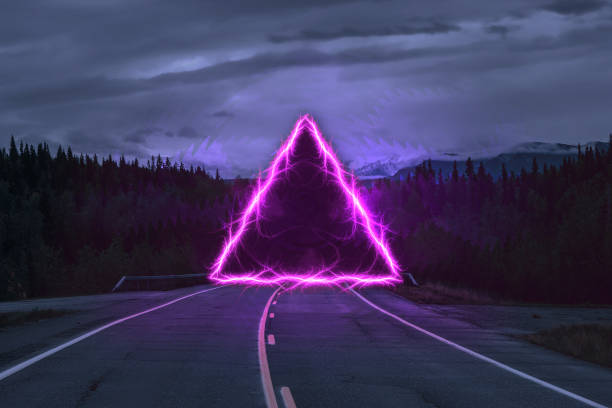 Fantasy triangular portal in the middle of the highway stock photo