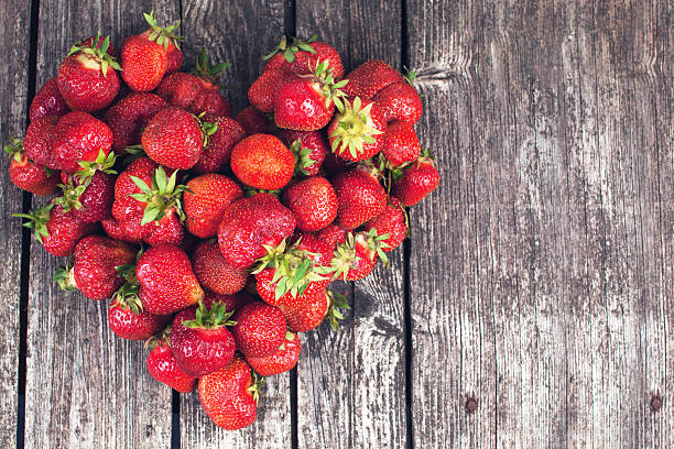 Farmer strawberries on dark background stock photo