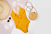istock Fashion bamboo bag and sunglass, straw hat and swimsuit. Flat lay, top view. Summer Vacation concept. 1153294455