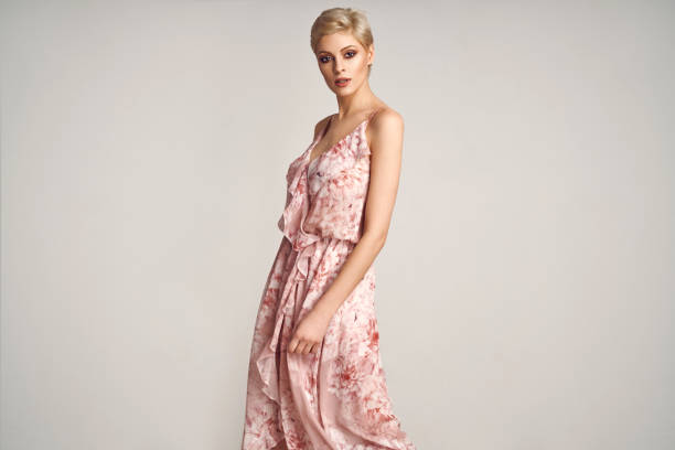 Fashion elegant woman posing in summer dress stock photo