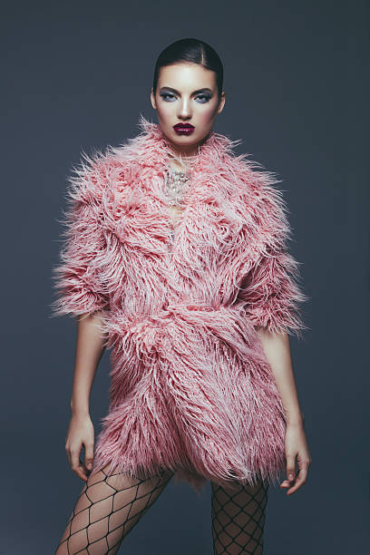 Fashion model in fur coat stock photo