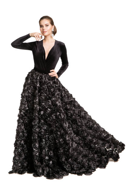Fashion Woman in Black Dress, Elegant Beautiful Model in Evening Gown over White Background Fashion Woman in Black Dress, Elegant Beautiful Model in Long Evening Gown over Cut out White Background evening gown stock pictures, royalty-free photos & images