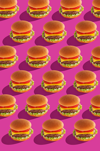 cheeseburgers on a colored background in a modern design