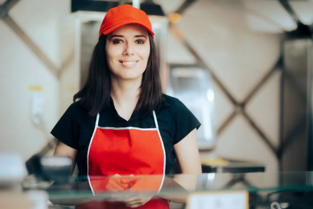 Fast Food Vendor Smiling Behind the Counter stock photo