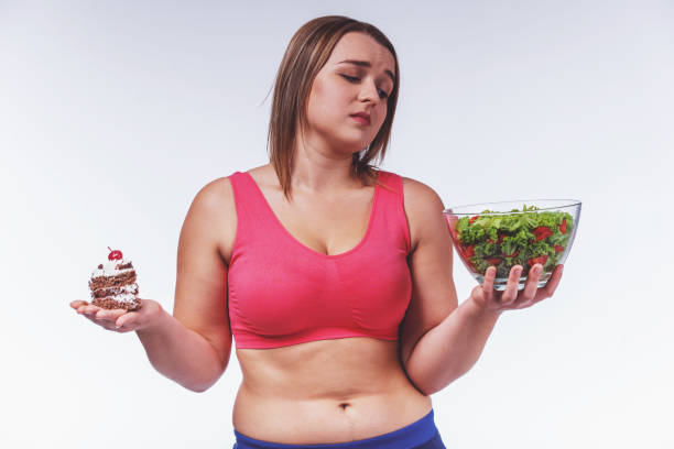 Fat woman dieting stock photo