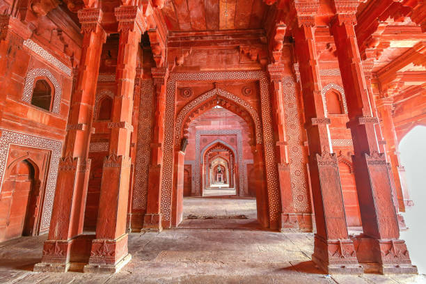 Fatehpur Sikri medieval Mughal architecture built of red sandstone with intricate ancient wall art at Agra, India stock photo