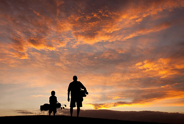 Father and Son Golf Silhouette  fathers day stock pictures, royalty-free photos & images