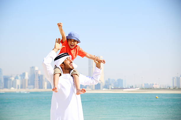 Father and Son Arabian family playing in the beach agal stock pictures, royalty-free photos & images