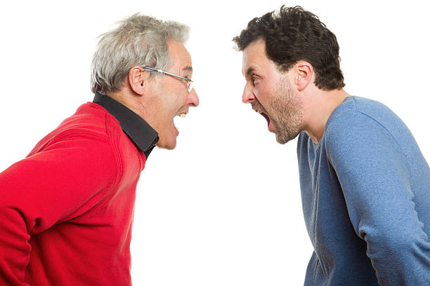 Father and son screaming, Generation conflict, argument stock photo