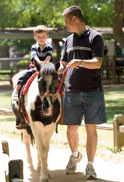 Father and Son with Pino Pony stock photo