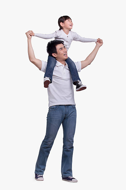 Father carrying daughter on his shoulders, studio shot Father carrying daughter on his shoulders, studio shot chinese girl hairstyle stock pictures, royalty-free photos & images