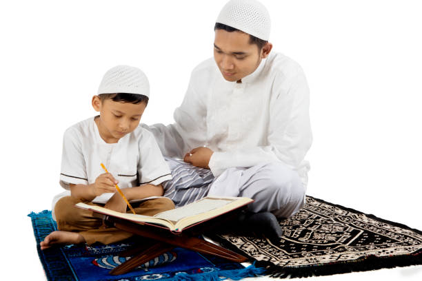 father-teaching-his-son-reading-quran-picture-id685391794