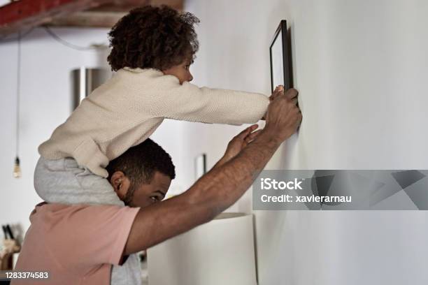 Father with Young Daughter on His Shoulders Hanging Picture