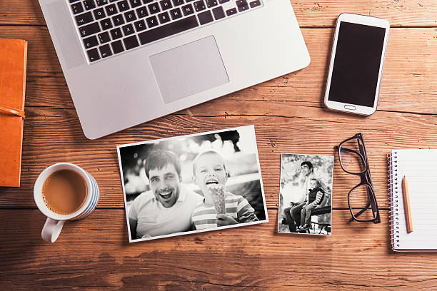 Fathers day composition. Black-and-white photo. Office desk. Fathers day composition. Black-and-white photos. Office desk. Studio shot on wooden background. desk photos stock pictures, royalty-free photos & images
