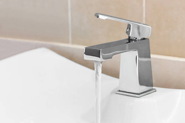 Faucet in bathroom stock photo