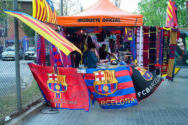 fc barcelona shop "Barcelona, Spain-april 21, 2012 :sellers are working at the street shop of flags, scarfs and other atributs of FC Barcelona, situated close to the stadium Camp Nou in Barcelona" FC Barcelona stock pictures, royalty-free photos & images