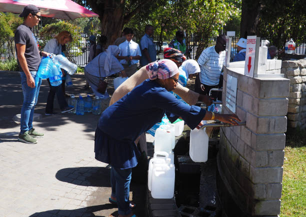8 February 2018 - Cape Town, South Africa : Capetonians queue for water as their taps threaten to run dry. stock photo