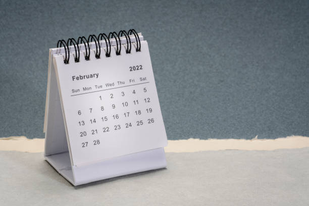 February 2022 - spiral desktop calendar stock photo