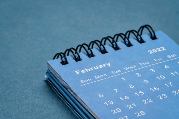 February 2022 - spiral desktop calendar stock photo