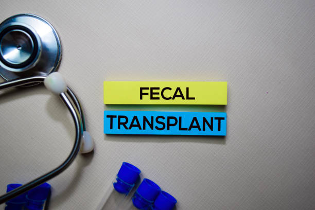 Fecal Transplant text on Sticky Notes. Top view isolated on office desk. Healthcare/Medical concept stock photo