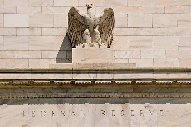 Federal reserve building eagle statue close up of the eagle statue on the Federal Reserve building in Washington DC federal reserve stock pictures, royalty-free photos & images