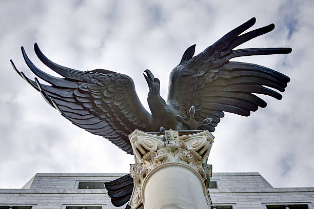 Federal Reserve Eagle in Atlanta, Georgia Cast in Rome, Italy, in 1964 by American sculptor, Elbert Weinberg, this bronze eagle along with its column was moved from the old federal reserve bank to the new headquaters in 2001. federal reserve stock pictures, royalty-free photos & images
