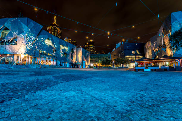 Federation Square in Melbourne, Australia at night. Melbourne, Australia - 05th March 2020: The Flinders Street, nightlife at the Federation Square as a long exposure. federation square stock pictures, royalty-free photos & images