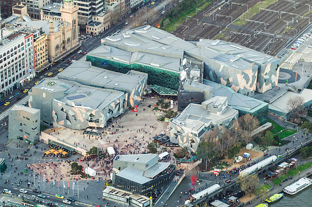 Federation Square in Melbourne Aerial view of Federation Square in Melbourne, Australia, an entertainment, museum and restaurant hub constructed over old railyards. federation square stock pictures, royalty-free photos & images
