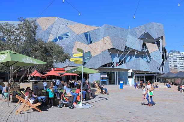 Federation Square Melbourne Melbourne Australia - August 23, 2014: Tourists sightsee artistic design of Federation Square in Melbourne federation square stock pictures, royalty-free photos & images