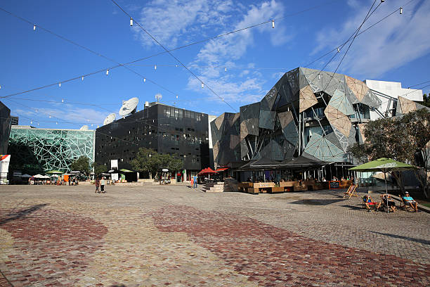 Federation Square Melbourne, Australia - January 11, 2013: Federation Square in the Heart of Melbourne. Its a popular place for tourists and local people. There are some Restaurants and Cafes and sometimes fantastic street performers. federation square stock pictures, royalty-free photos & images