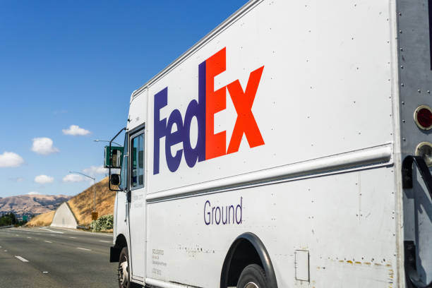 FedEx truck driving on the freeway stock photo