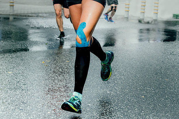 feet girl runners in compression sock stock photo