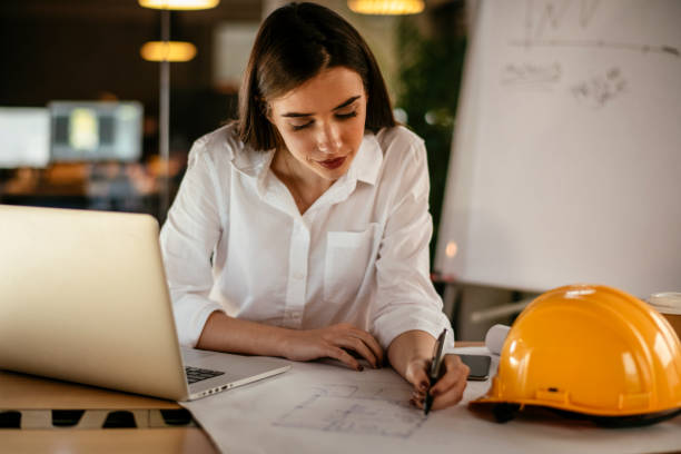 Female architect working on project stock photo