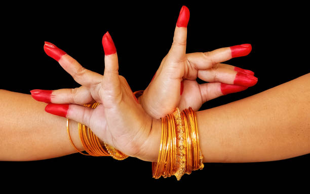Female dancer hand in black background demonstrating Bharatanatyam Indian classical dance mudra Female classical dancer hands on black background showing "Katakavardhana hasta" denoting a coronation ceremony, worship or marriage as a mudra of Bharata Natyam dance bharatnatyam dancer stock pictures, royalty-free photos & images
