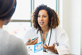 istock Female doctor discusses healthcare with patient 1342134439