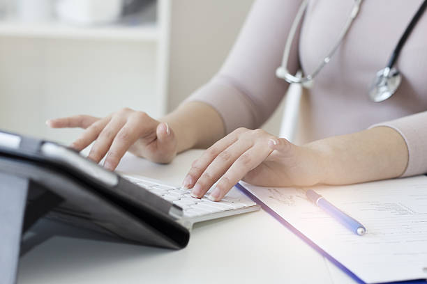 Female doctor using a digital tablet stock photo