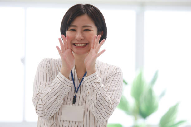 Female employees cheering stock photo
