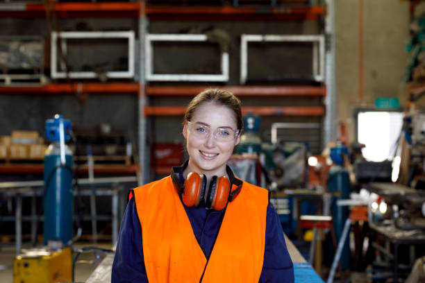 Female Factory Metal Worker In Protective Clothing stock photo