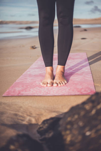 Female feet yoga mat stock photo