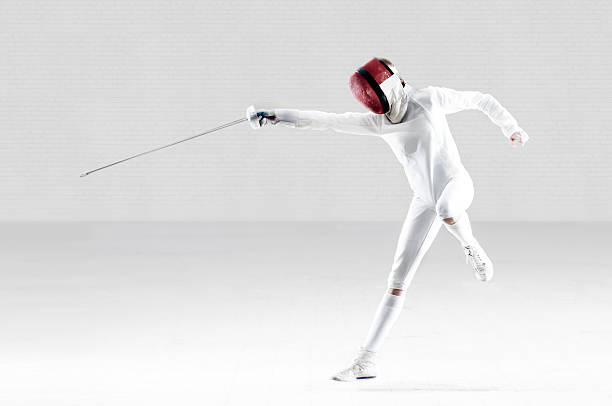 Female Fencer In Action stock photo