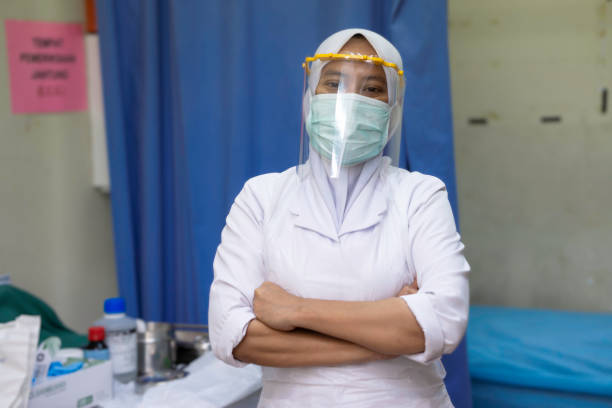 Female frontliner performing her tasks during the coronavirus pandemic. stock photo
