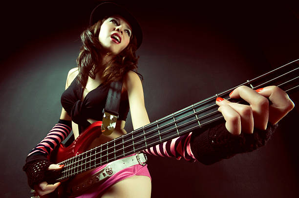 female guitarist stock photo
